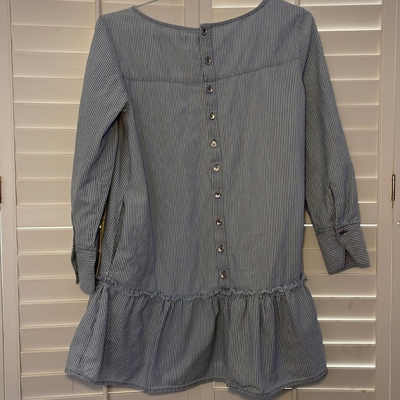 Zara Dresses & Skirts - Zara Trafaluc denim dress frayed around the ruffled hem button down the back‎